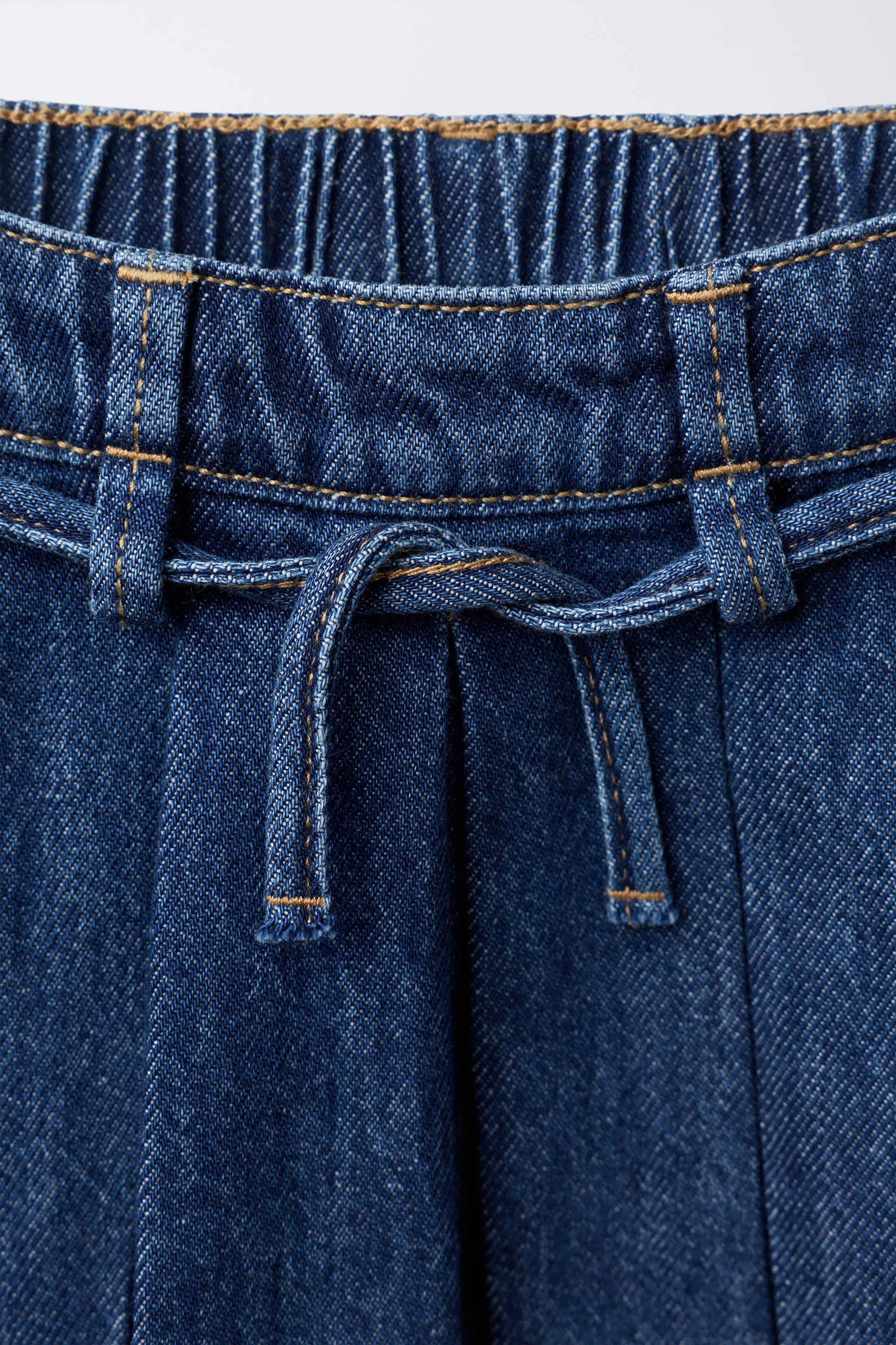 PLEATED DENIM SKIRT